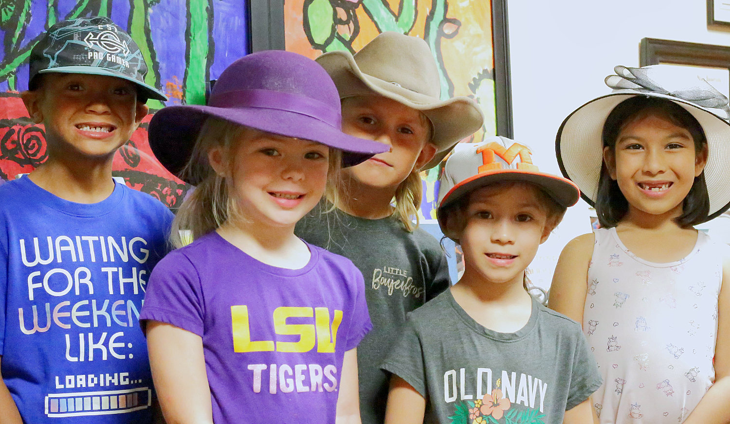 Mineola Elementary School students don various head wear in support of classmate Isabelle Riley. Her sister, first-grader Alaina Alons (in purple fedora), is pictured with classmates (from left) Triston Milton, Brayden Walkley, Mia Martin and Felicia Gonzalez.
